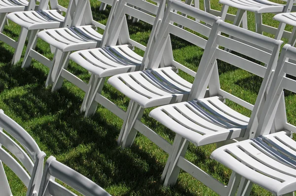 Lawn chairs on grass — Stock Photo, Image