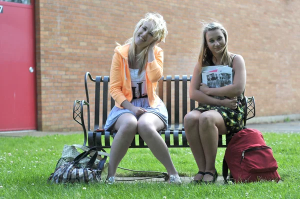 Two Teenage Girl Friends Sitting Front High School Building Bench — Stock Photo, Image