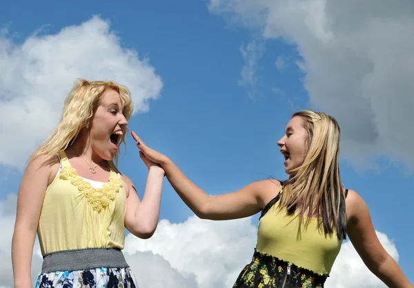 Young happy girls highfive — Stock Photo, Image
