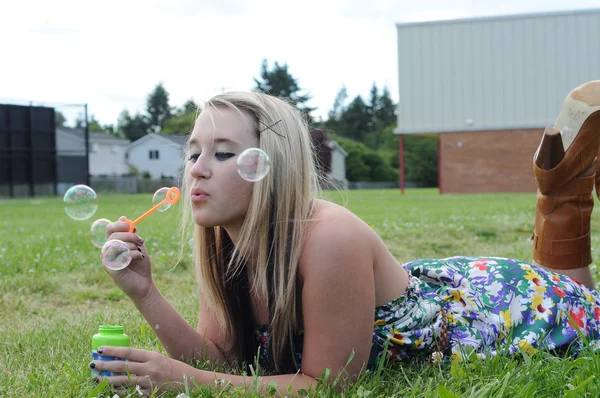 Young White Caucasian Teenage Girl Laying Grass Blowing Bubbles Playfully — Stock Photo, Image