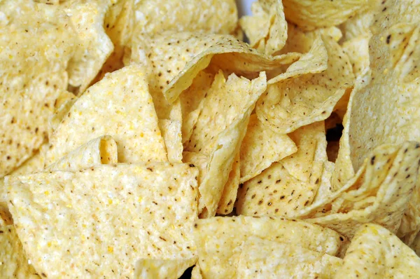 Close Corn Triangular Tortilla Chips Filling Entire Frame — Stock Fotó