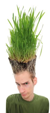 A young man looking upward at the grass growing from the roots on top of his head. This concept can apply to environmentalists, farmers, agriculture, landscapis clipart