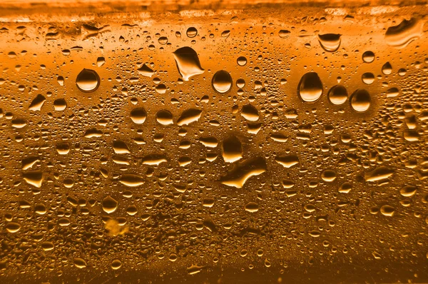 Orange Kondens Vattendroppar Glas Med Bakre Ljus — Stockfoto