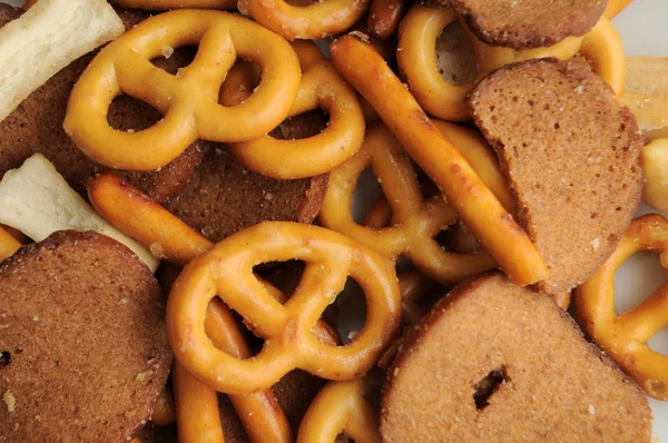 stock image A bunch of pretzels and other breads assorted in a various trail mix.