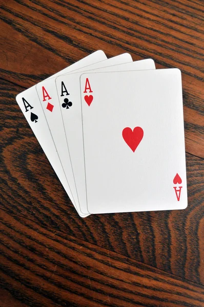 Dört as - tahta masada oyun kartları — Stok fotoğraf