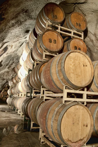 stock image Wine keg barrels stacked underground to keep cool.