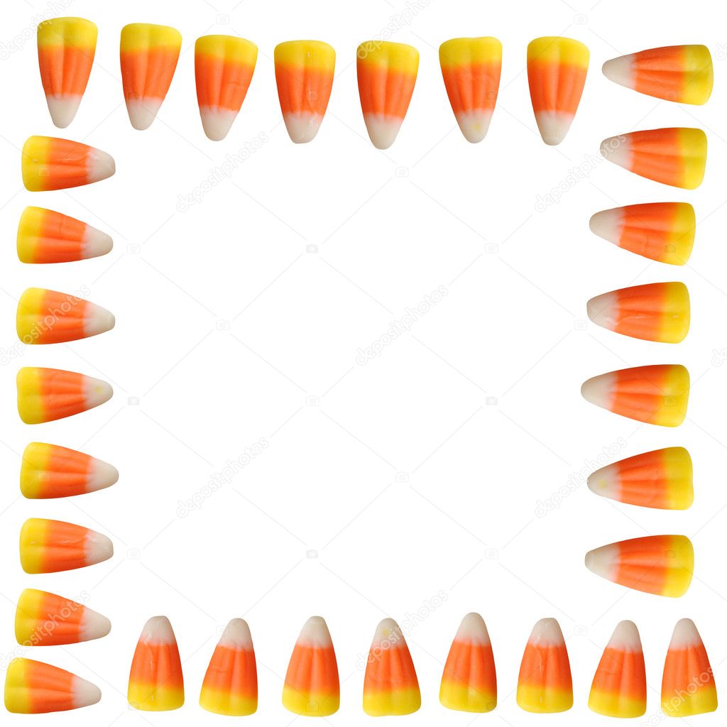 Halloween candy corn arranged in a border isolated on white background