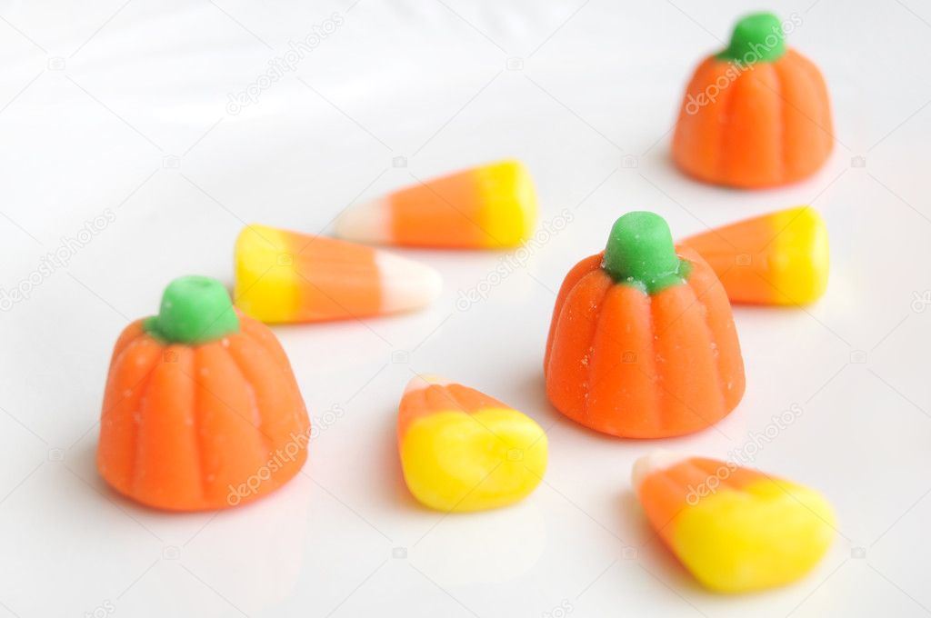 A pile of Halloween candy corn on a white background.