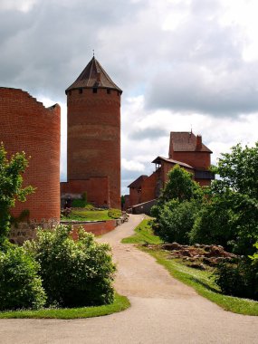 Tower Bergfried and ruins of Turaida medieval Castle, Latvia, Europe clipart