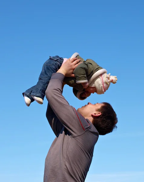 stock image Father with baby under blue sky