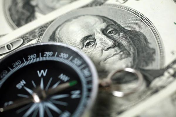 Compass and money — Stock Photo, Image