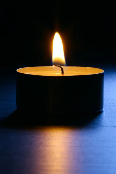 Candle Closeup Dark Wooden Table Blue Back Lit Close Shot Stock Picture