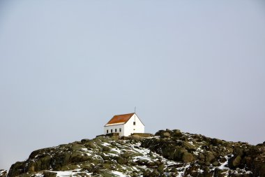 A single house on the top of mountain clipart