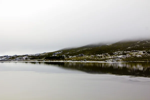 stock image Mountain landscape, lake and fog