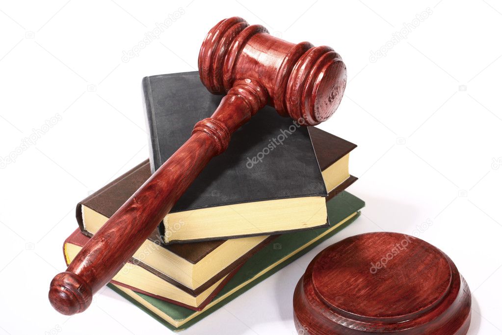 Books and gavel isolated over white
