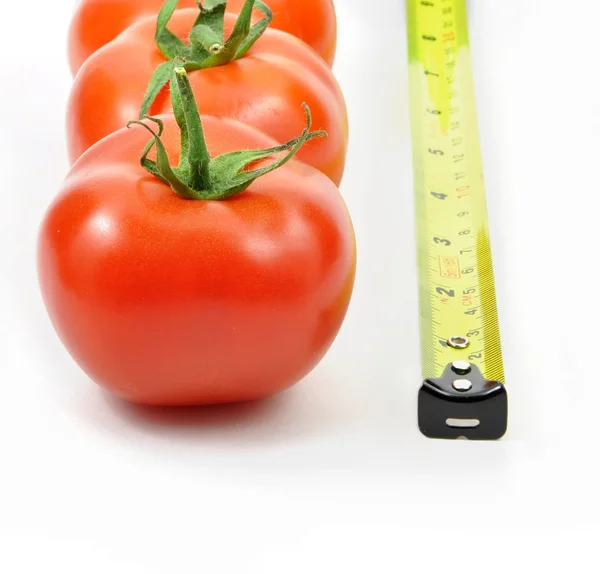 Fresh tomatoes and ruler — Stock Photo, Image