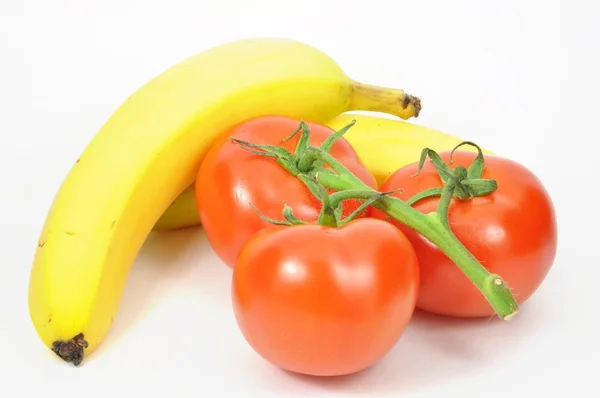 Geïsoleerde Tomaten Bananen — Stockfoto