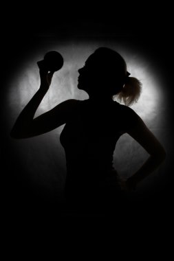 Silhouette of a girl with an apple clipart