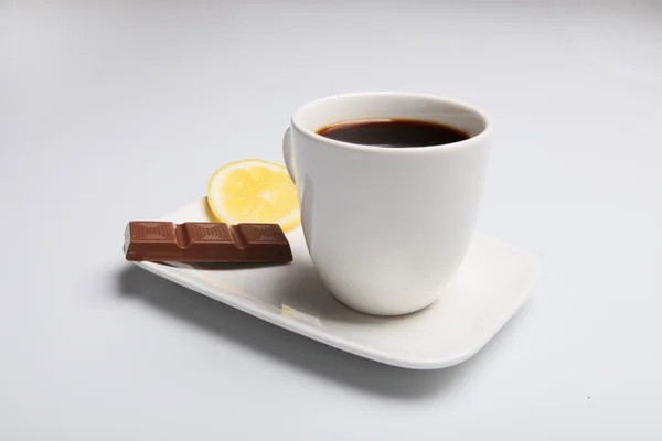 stock image Black coffee with milk chocolate and lemon