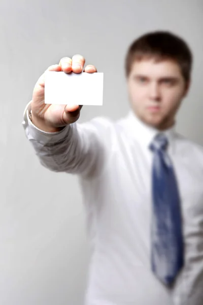 Man with bussines card white background — Stock Photo, Image