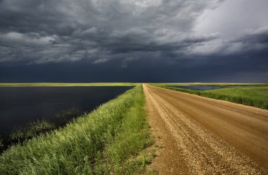 Storm Clouds over Prairie slough clipart