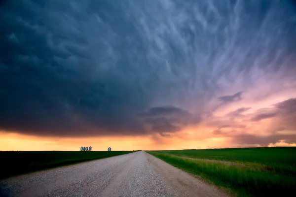 stock image Storm Clouds over Saskatchewan country road