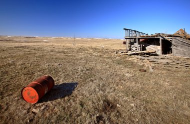 Old Barrell and Abandoned Car in Field clipart