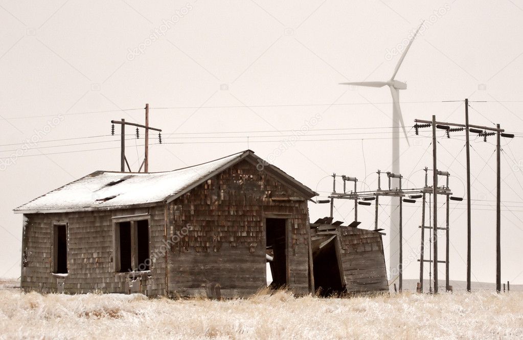 Wind farm and power lines near abandoned homestead