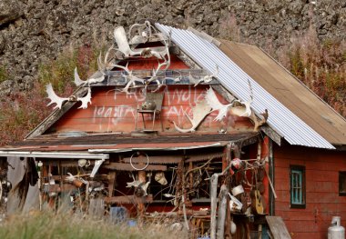 Antlers on native dwelling in British Columbia clipart