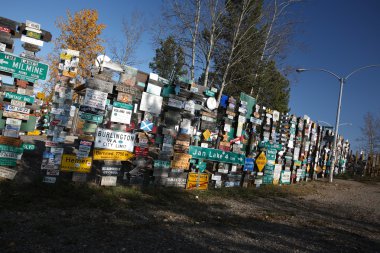 Sign posts forest in Watson Lake Yuko clipart