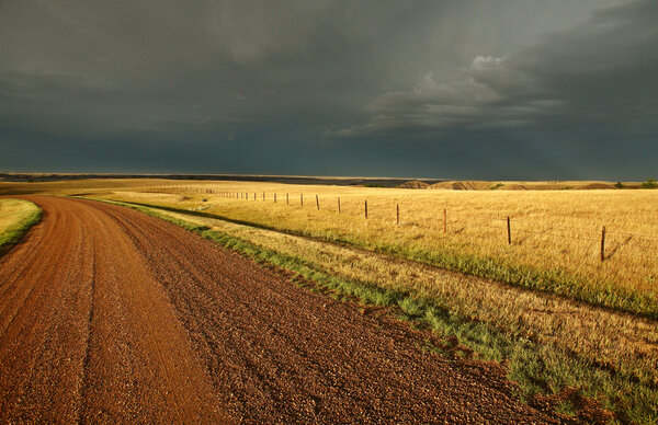 Storm clouds along a Saskatchewan country road