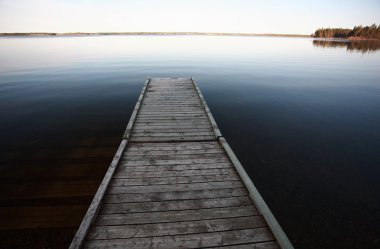Dock on Northern Manitoba lake clipart