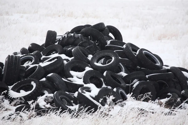 stock image Pile of used tires in winter