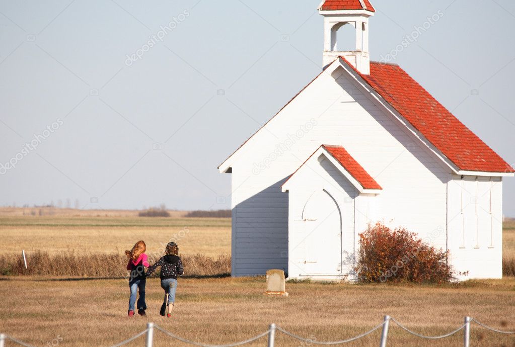 Young girls walking in Saint Columba Church yard