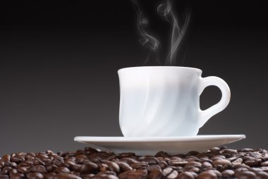 Cup of hot drink with steam on the coffe beam's clipart