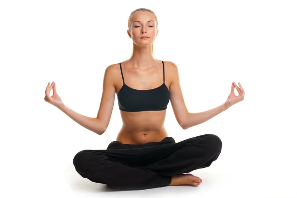 stock image Young woman doing yoga exercise