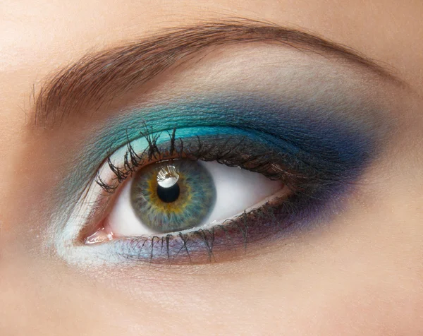 Modern fashion blue makeup of a female eye - macro shot — Stock Photo, Image