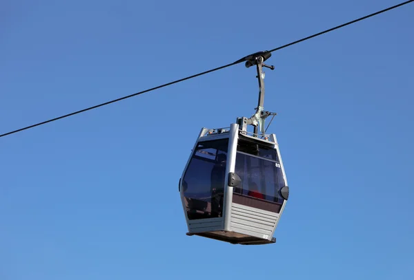 stock image Cabin of a gondola lift climbing on its steel cable