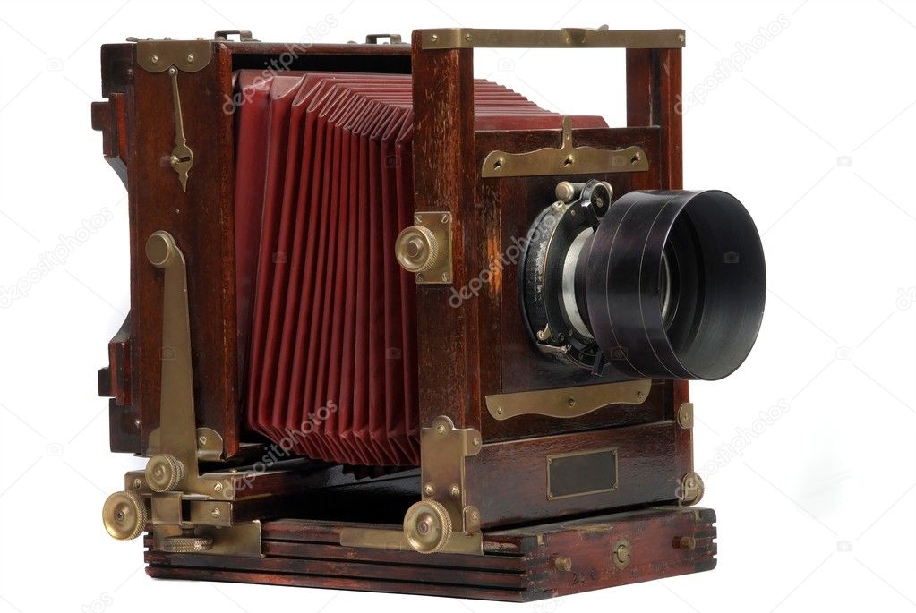 Old wood frame photo camera with lens
