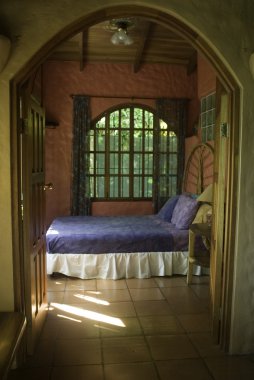 Bedroom through arched doorway clipart