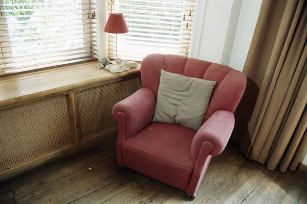 Armchair by window — Stock Photo, Image