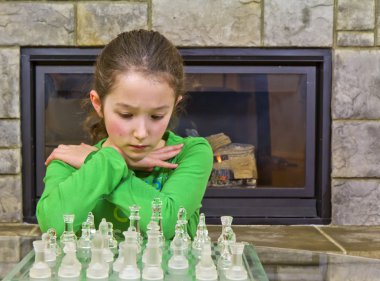 Young girl making some quick decisions during the match clipart