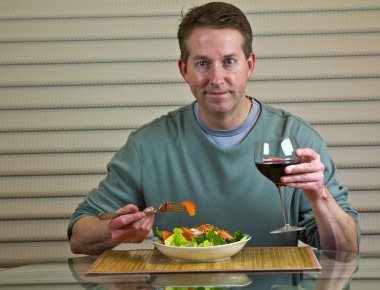 Salad, wine and middle age man clipart