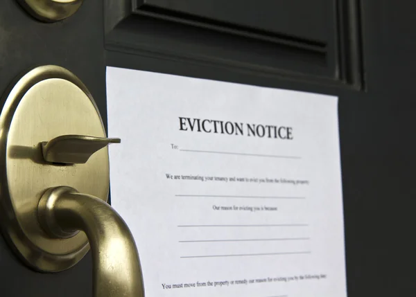 Eviction Notice Letter on Front Door Stock Picture