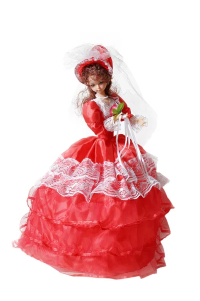 stock image Bride doll in a red dress on a white background