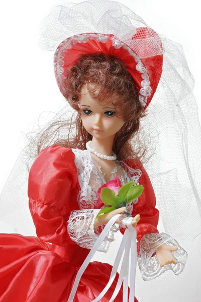 stock image Bride doll in a red dress on a white background close up