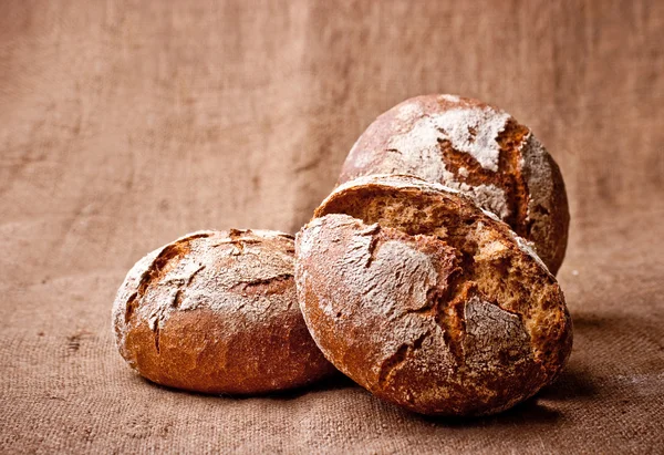 Homemade Whole Break Dark Bread Sacking Background — Stock Photo, Image