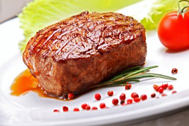 Grilled steak with greens clipart