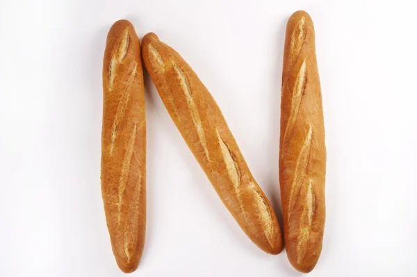 Wit Brood Zijn Een Rij Een Witte Achtergrond — Stockfoto