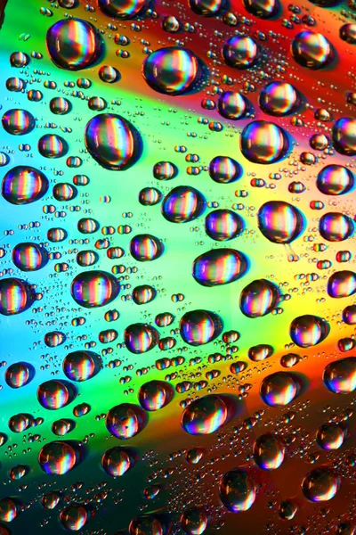 Vícebarevné kapky vody — Stock fotografie